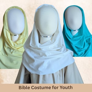 May include: Three Bible costumes for youth in yellow, white, and teal. Each costume features a draped head covering and a neutral-colored garment. The text "Bible Costume for Youth" is at the bottom of the image.