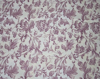 Tela patchwork con estampado floral.