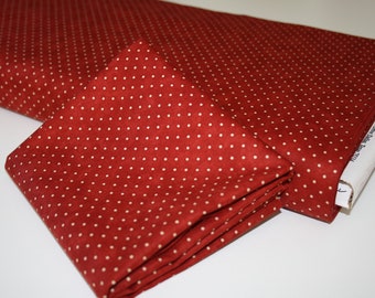 Patchwork fabric with red dots