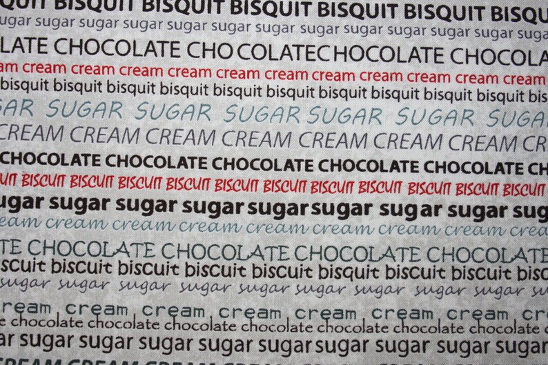 May include: A close-up of a textured background with the words "Biscuit", "Sugar", "Cream", and "Chocolate" repeated in various sizes and colors. The words are written in a handwritten style, creating a whimsical and playful feel.