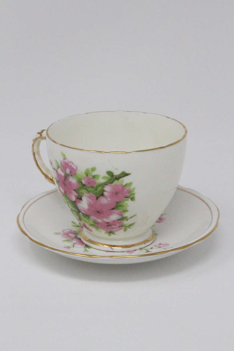 Sutherland English and Royal Stafford Bone China Teacup with matching Peach Blossoms pattern.