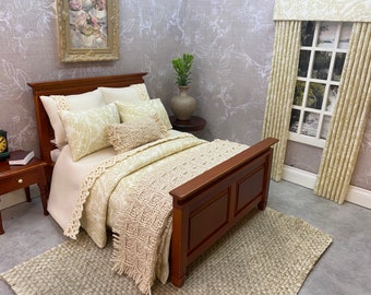 May include: A wooden bed frame with a white and cream patterned bedding set. The bed has a throw blanket and pillows. The bed is in a room with a floral wallpaper and a window with curtains.