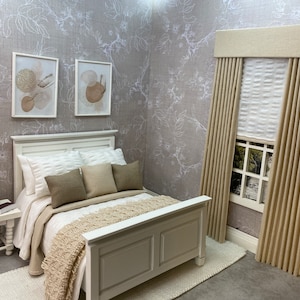 May include: A white bed with a beige blanket and pillows in a bedroom with beige walls and a window with beige curtains.