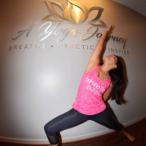 Modern yoga studio logo sign made from high-quality aluminum. Mixed brushed and grinded finishes add texture and style to this custom 80" x 24" business sign. Ideal for outdoor use, includes spacers for an elevated, floating design.