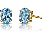 Oval cut Blue topaz 5a grade cubic zirconia .925 sterling silver stud earrings