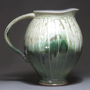 Pitcher with green ash shiny green glazes