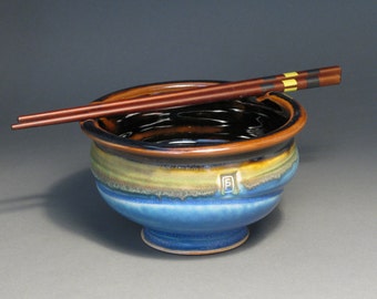 Rice or noodle bowl with chopsticks