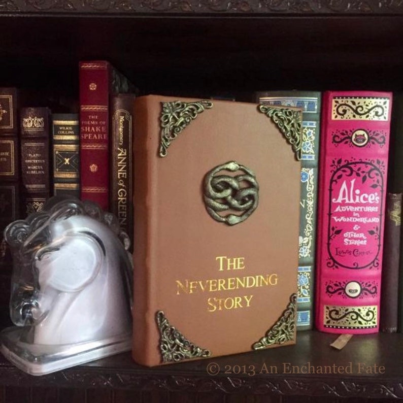 The Neverending Story book, leather bound special illustrated edition, on bookshelf with other special books, and white horse bookened, "Artax"