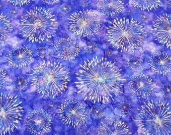 May include: A fabric with a repeating pattern of white starbursts on a deep blue background. The starbursts have a textured, detailed design, and the background has a mottled, watercolor-like effect. The overall design is reminiscent of fireworks.