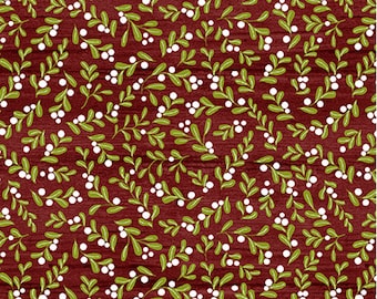 May include: Red fabric with a white and green repeating pattern of small sprigs and berries. The fabric is textured and has a woodgrain appearance.