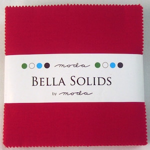 May include: A red fabric square with a white label that reads "moda Bella Solids by moda" with green, white, blue, and black circles.