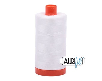 May include: A white spool of Aurifil thread with an orange plastic bobbin. The spool is labeled "Aurifil" in blue and white text.