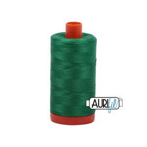 May include: A spool of green thread with an orange plastic top. The spool is labeled "Aurifil" in blue and white text.