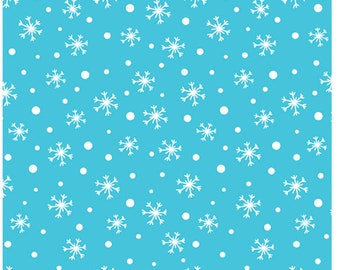 May include: A blue fabric with a white snowflake and dot pattern. The fabric is measured with a ruler in inches.