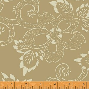 May include: A beige fabric with a white floral pattern. The pattern features stylized flowers and leaves. A ruler is included in the image for scale.