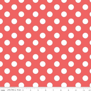 May include: A coral pink fabric with a white polka dot pattern. The fabric is a repeating pattern of white circles on a solid coral pink background.