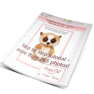 May include: A step-by-step photo tutorial for making a 15.5 cm artist teddy bear called Lori Lenni. The tutorial includes over 265 photos and is available as a PDF download. The cover features a close-up of the finished teddy bear, which is brown and white with large, expressive eyes.
