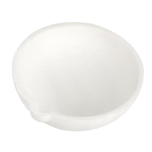 May include: A white ceramic crucible, a small bowl-shaped container used for melting and heating materials at high temperatures.