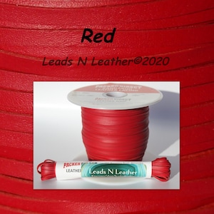 May include: Red leather cord, wound around a spool, with a label that reads "Leads N Leather®2020".