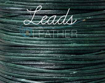 May include: A close-up of a spool of dark green leather cord. The cord is tightly wound and has a smooth, polished finish. The text "Leads n Leather" is visible on the spool.