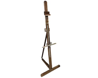 May include: A wooden artist's easel with a brown finish. The easel has a adjustable height and a canvas holder.