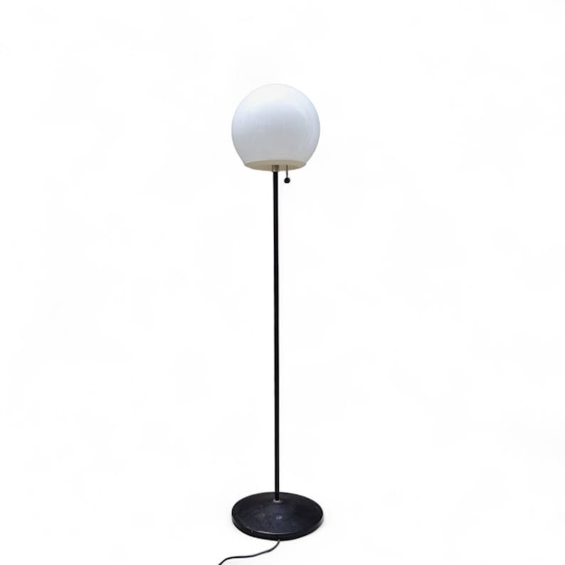 Vintage glass orb mid century atomic style floor lamp black and white.