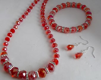 Precioso conjunto de collar con pulsera y pendientes a juego de plata 925 con cristales rojos AB.