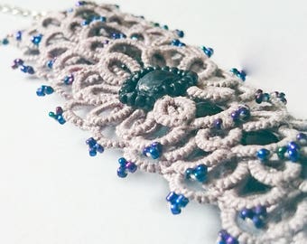Light grey ornate tatted lace layered bracelet with blue beads