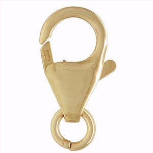 May include: Gold-toned lobster clasp with a spring ring closure. The clasp is made of metal and has a polished finish.