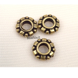 May include: A handmade wooden sign with the text "Welcome" in a playful font. The sign features a distressed finish and a simple, inviting design, perfect for a front door or entryway. The sign measures approximately 12 inches wide.