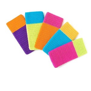May include: A collection of colorful, crocheted rectangular items. Each item features two distinct color blocks, including shades of orange, purple, yellow, blue, and pink. The items are arranged on a white background.