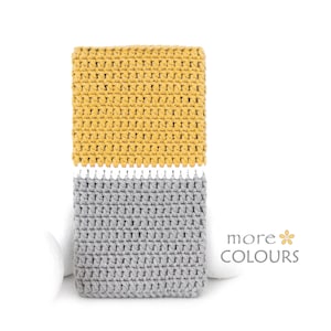 May include: Two crocheted squares, one mustard yellow and one gray, are displayed against a white background. The squares have a textured appearance, showcasing the detailed stitch work. The text "more COLOURS" is visible in the lower right corner.