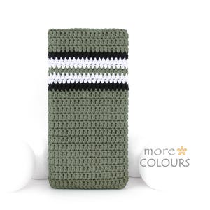 May include: A green crocheted phone case with black and white stripes.