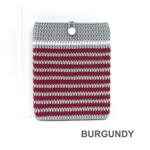 Crocheted e-reader soft case made of Grey durable cotton yarn with Burgundy stripes and White stripe above them. The e-reader cover closes with a White plastic button and a strong loop.