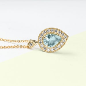 Pear shaped aquamarine and diamond necklace white or yellow 14K gold, Halo pendant image 4