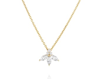 May include: A delicate gold chain necklace with a pendant featuring a cluster of sparkling white diamonds in a flower-like design.