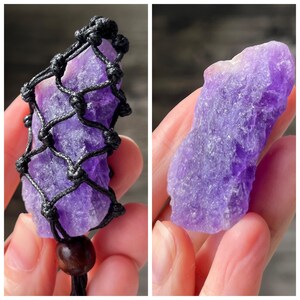 May include: A purple amethyst crystal wrapped in a black macrame cord, hanging from a brown wooden bead. The crystal is raw and has a natural, irregular shape.