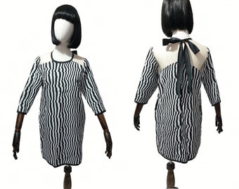 1960s style op-art black and white mod shift dress with black bow and hidden pockets. Size small.