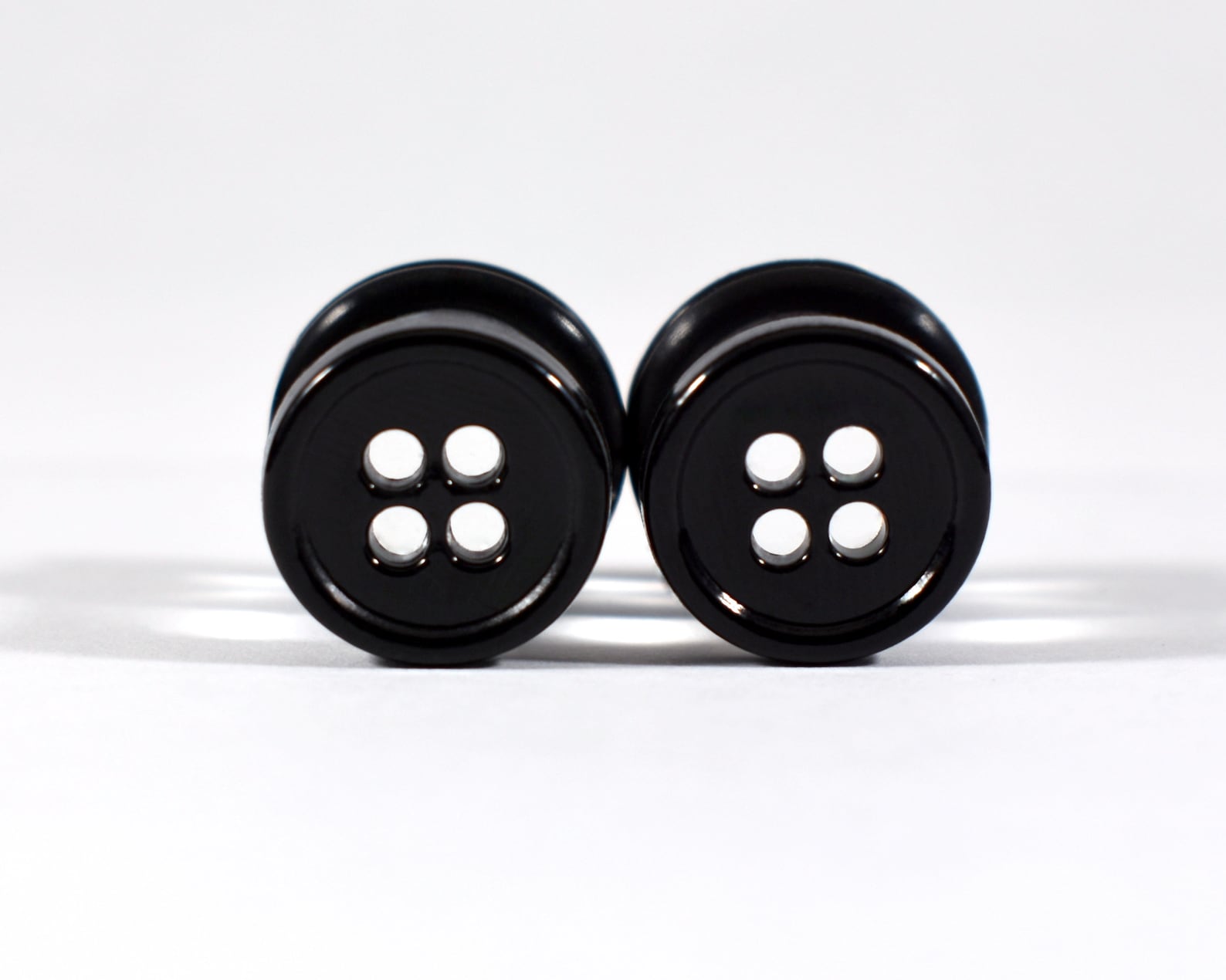 Plug button. Plugs.