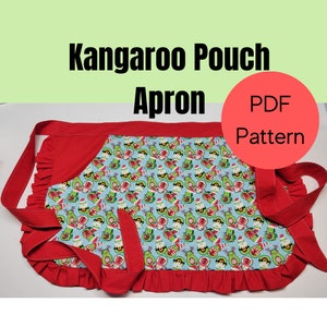 May include: A red and blue apron with a kangaroo pouch design. The apron features a light blue fabric with a pattern of avocados in Santa hats. The apron has red trim and ties, and the text "Kangaroo Pouch Apron" is visible.