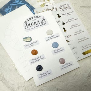 May include: A selection of colour cards for January 2020 from Julia K art studio. The cards display colour swatches with names such as Veritaserum, Saffron, and Harald. The cards also include the text "colorcard January".