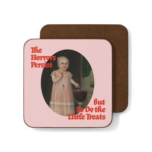 May include: Square coaster with a pink background and a vintage painting of a child holding a cherry. Text reads "The Horrors Persist But So Do the Little Treats" in red. The coaster has a brown cork backing.