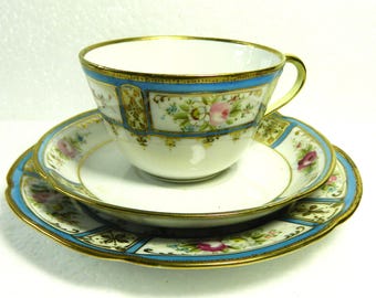 An exquisite Noritake tea trio with roses and raised gilding. C.1920+