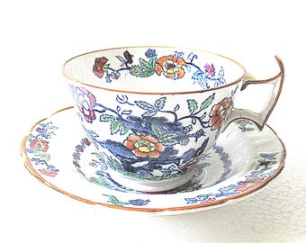 Booths Antique 1908 Cup and saucer in the The pompadour pattern