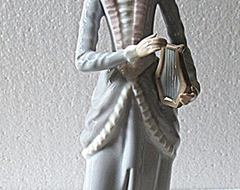 Casades Noble woman playing a harp figurine