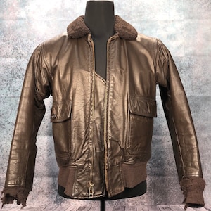 1970s Navy Type G-1 Leather Flight Jacket Flyer's Intermediate Type G-1  size 42 MIL-J-7823E (AS) Star Sportswear Mfg Corp 1975