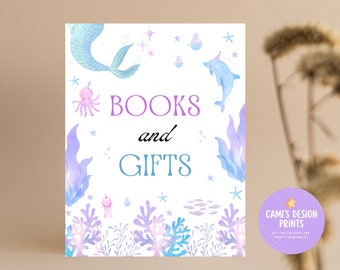 May include: A printable sign with a mermaid, a dolphin, and seaweed illustrations. The sign says "BOOKS and GIFTS" in purple and blue text.