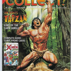 May include: A magazine cover featuring a muscular man with a loincloth, holding a knife and standing over a sleeping lion. The cover text reads "Joe Jusko's Tarzan: King of the Card Jungle". The magazine is titled "Collect!" and is a guide to non-sports and entertainment cards.