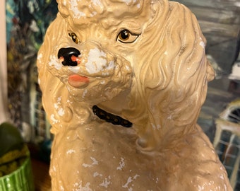 Wonderful chippy vintage chalkware poodle statue on a pillow