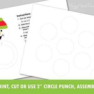 May include: Printable snowman craft kit with instructions. The kit includes a snowman face with a red and green hat, and a series of white circles. The text at the bottom reads: PRINT, CUT OR USE 2" CIRCLE PUNCH, ASSEMBLE.